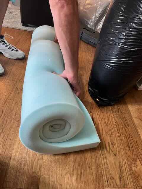 Rolled up 3 inch mattress topper