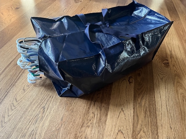 moving hanging clothes in a moving bag better than garbage bag over hanging clothes hack