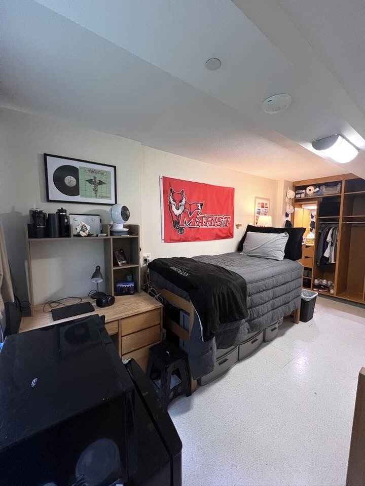 boys dorm room with desk and desk hutch twin xl bed and open closet