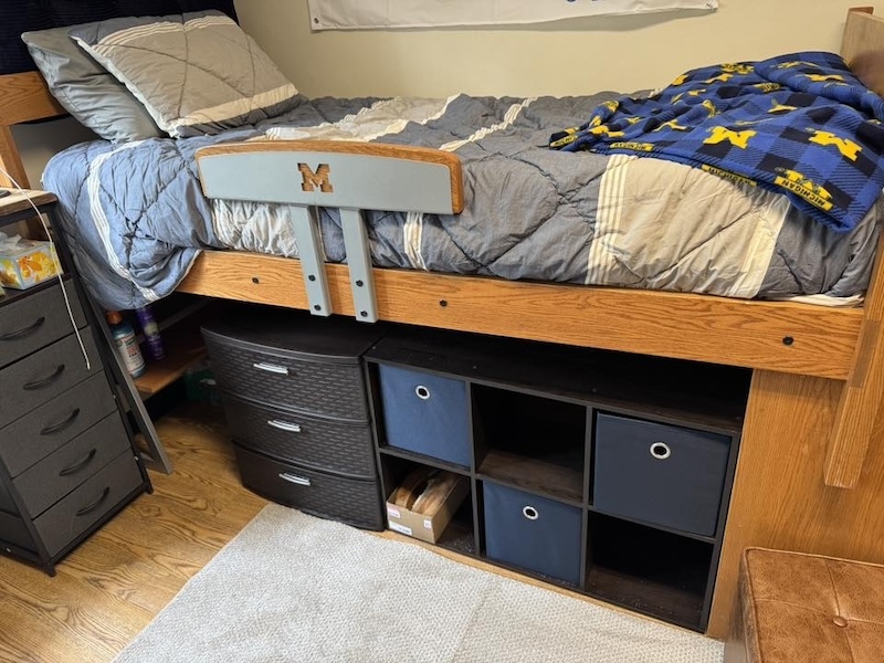 University of Michigan boys dorm room bed and nightstand