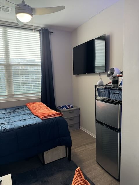 A 2 door dorm mini fridge in an off-campus furnished apartment